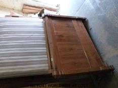 A continental fruitwood bed