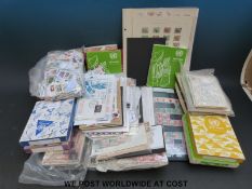 A large quantity of loose all-world stamps in a box