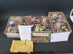 A vintage case containing an all world collection of matchboxes, examples include boxes from Spain,