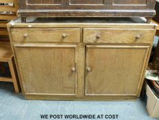 An oak sideboard in the style of Utility furniture,