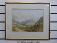 A pair of framed Irish watercolours of mountain landscapes,