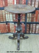 A carved Victorian tripod table (H75 x Diameter 52cm)