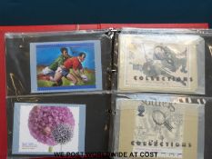 Four albums of first day covers,