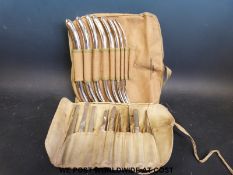 A canvas roll by William Bros London containing eight Hegar double ended surgical dilators,