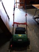 A Qualcast electric lawn scarifier
