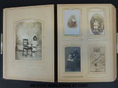 A Victorian 'Carte Visite' photograph album containing mainly early 20thC portraits,