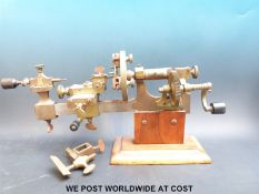 A 19thC watchmakers lathe (overall length 32cm) with various attachments