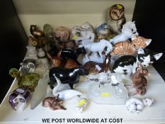 A collection of approximately 30 various ceramic and glass animals including Russian porcelain and