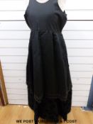 A late 19thC black satin and bead embellished dress with hoops sewn in