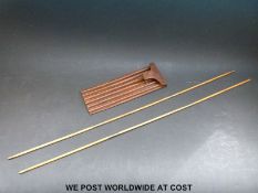 A leather cased set of spile rods by Buss of 33 Hatton Garden,