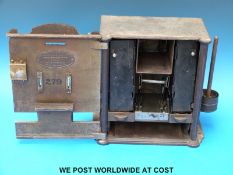 A Victorian Garretts 'Bijou Gold Changer' of cast iron construction and Art Nouveau design,