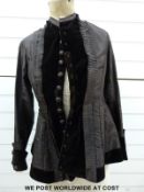 A 19thC brown silk and velvet bustle dress with a complete set of buttons