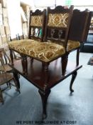 An early 20thC extending table with extra leaf, together with a set of four chairs (max L150,