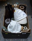 A collection of glass and stoneware bottles and jelly moulds