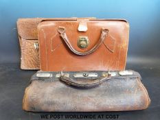 A doctor's Gladstone type bag together with two other vintage leather briefcases
