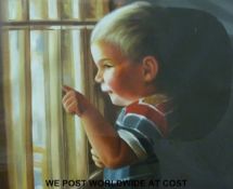 A framed oil of a boy at a window (44cm x 55cm)