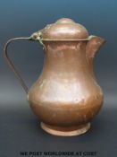 An Arts & Crafts copper flagon with domed lid (30cm tall)