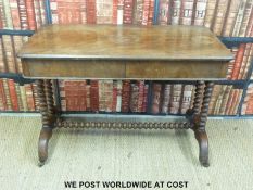 A 19thC mahogany library table with bobbin turned decoration and two drawers (H74 x W106 x D55cm)