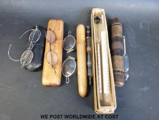 A treen cased hygrometer by Diabs, together with a similarly cased glass syringe,