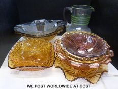 A collection of decorative brown pressed glass dishes together with a Deco-style opaque and green