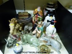 A variety of ceramics including novelty penguin biscuit barrel, elephants,