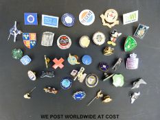 A selection of enamel badges including examples from WVS, SAAB,