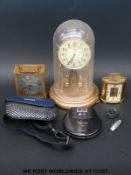A Swiza oval eight-day carriage clock together with an Ernst Jones quartz example,