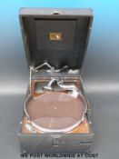 A rexine cased HMV wind up portable gramophone