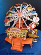 A scratch built fairground 'Supa Para Trooper' with pay booth to approximately 1/12 scale,