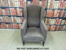 A 19thC club or wing back upholstered chair