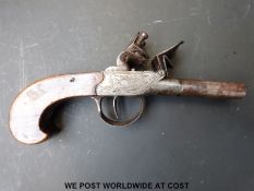 An English double barrelled side by side flintlock hammer action pocket pistol with ornate