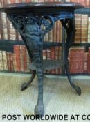 A cast iron Britannia pub table