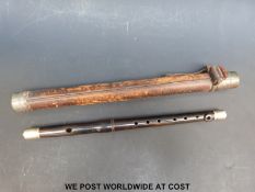 A military rosewood fife with white metal mounts in leather bound case. The mount engraved with GrR.