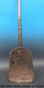 A wooden grain or malt shovel