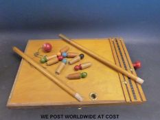 A wooden table skittles game or bar billiards game