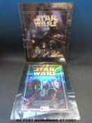 Two Star Wars sticker albums, one by Panini the other by Merlin,