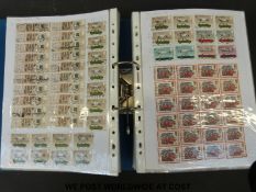 A large quantity of all world stamps in three ring binders