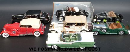 Seven Franklin and Danbury Mint diecast model cars,