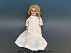 Societe de Fabrication des Bebes et Jouets (SFBJ) bisque headed doll with weighted deep blue eyes,