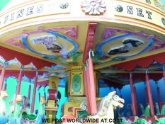 A scratch built set of fairground dobbies/juvenile carousel to approximately 1/12 scale,