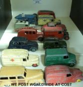 Fourteen Dinky Toys diecast model vehicles including delivery vans, racing car, fire engine,
