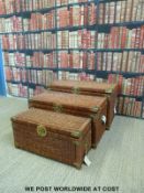 A set of three graduated brass bound wicker baskets / trunks (largest W91 D50 H51cm)