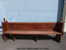 A 19thC carved pine pew (length 241cm)