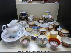 A collection of mainly continental tea and coffee cups and saucers including a Meissen ribbon plate,