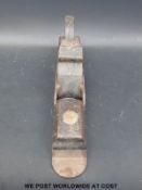 A fore woodworking plane with metal base, in the style of Norris, marked A.A.