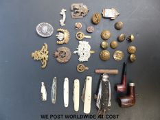 A quantity of military badges including Gloucestershire, Royal Artillery, Royal Engineers,