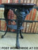 A cast iron Britannia pub table