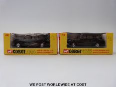Two Corgi Toys diecast model Austin London Taxis, 418, both with black bodies and red interiors,