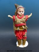 An unmarked French bisque headed doll with fixed blue eyes, open mouth,