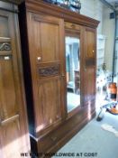 A late 19thC compactum / wardrobe, the right hand door opening to reveal drawers,